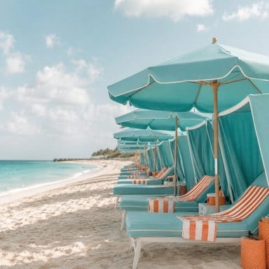 Row of turquoise beach cabanas and striped loungers